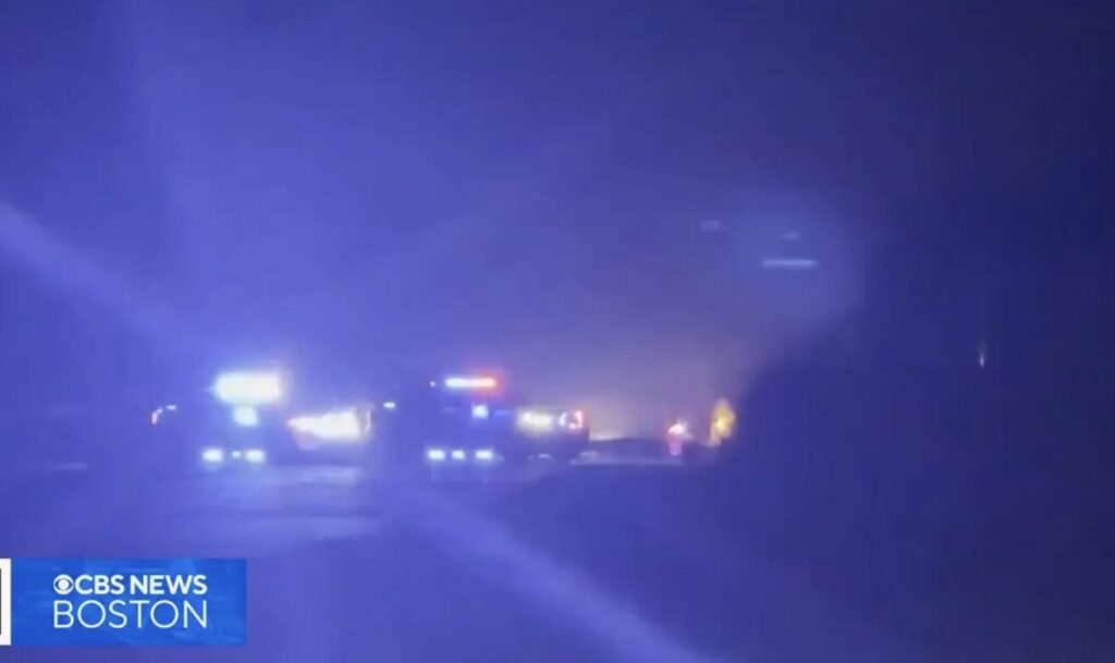 Nighttime scene of emergency vehicles with flashing lights at the Walton County car accident site, as reported by CBS News Boston.